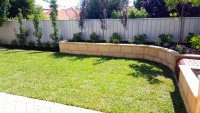 Lawn and Limestone Retaining Wall with Plants