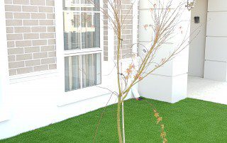 Synthetic Lawn with grass tree in center